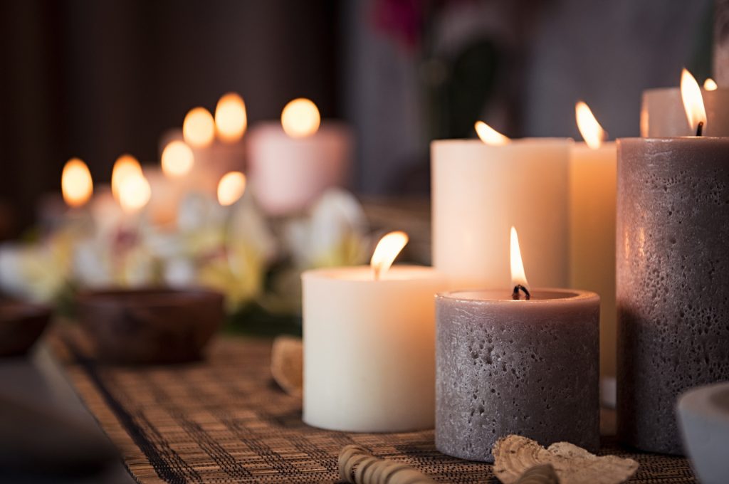 spa setting with aromatic candles e1585116161700